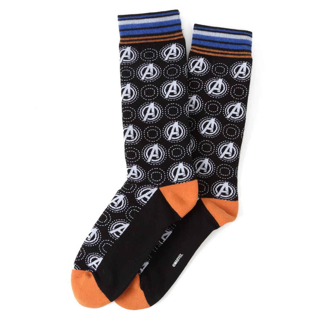 A pair of Marvel Argyle 3 Socks Pack and Lapel Pin Gift Set socks featuring an Avengers logo argyle pattern, orange heels and toes, and blue-striped cuffs.