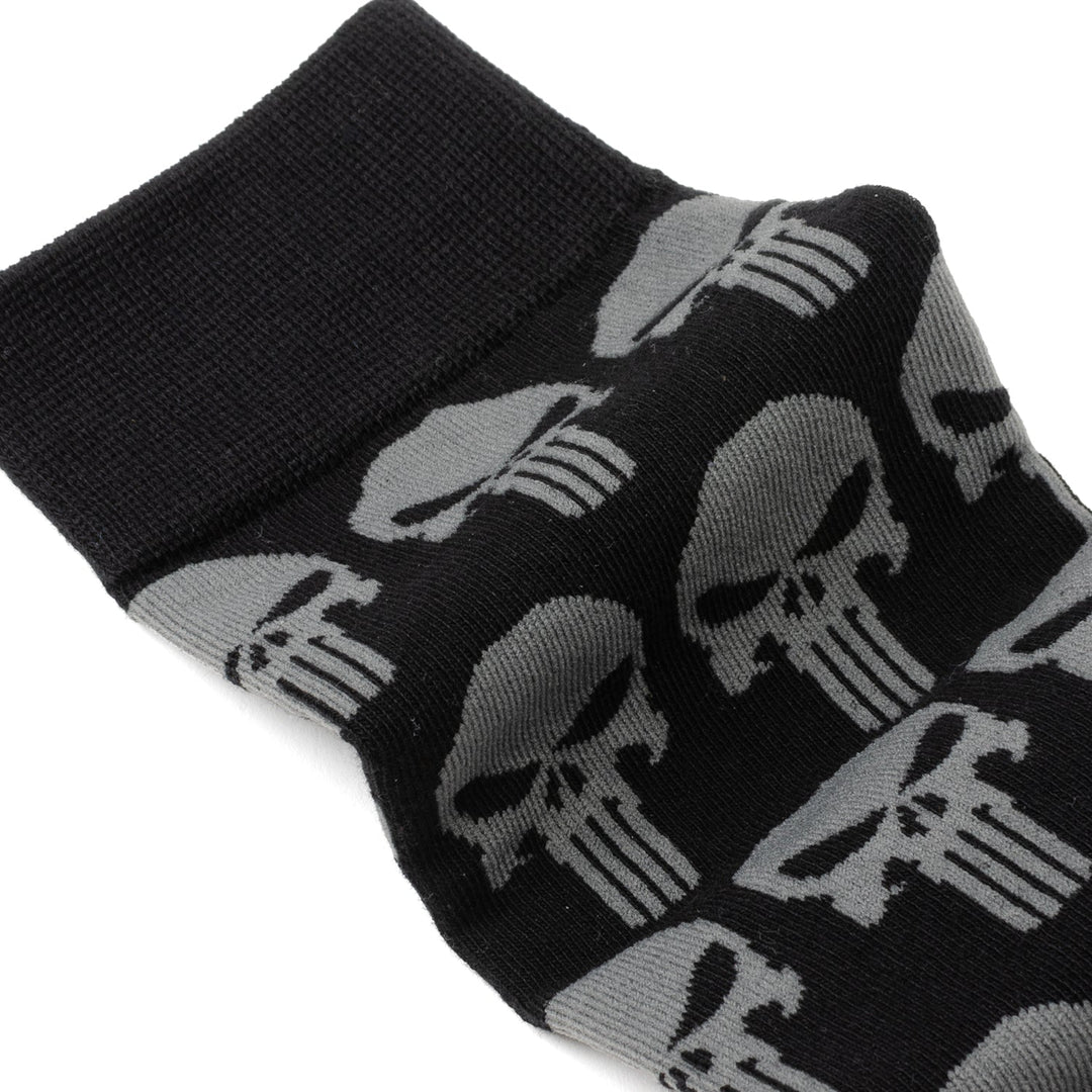 Marvel Punisher Black Socks and Silver Lapel Pin Gift Set featuring black crew socks with a repeating grey skull logo pattern.