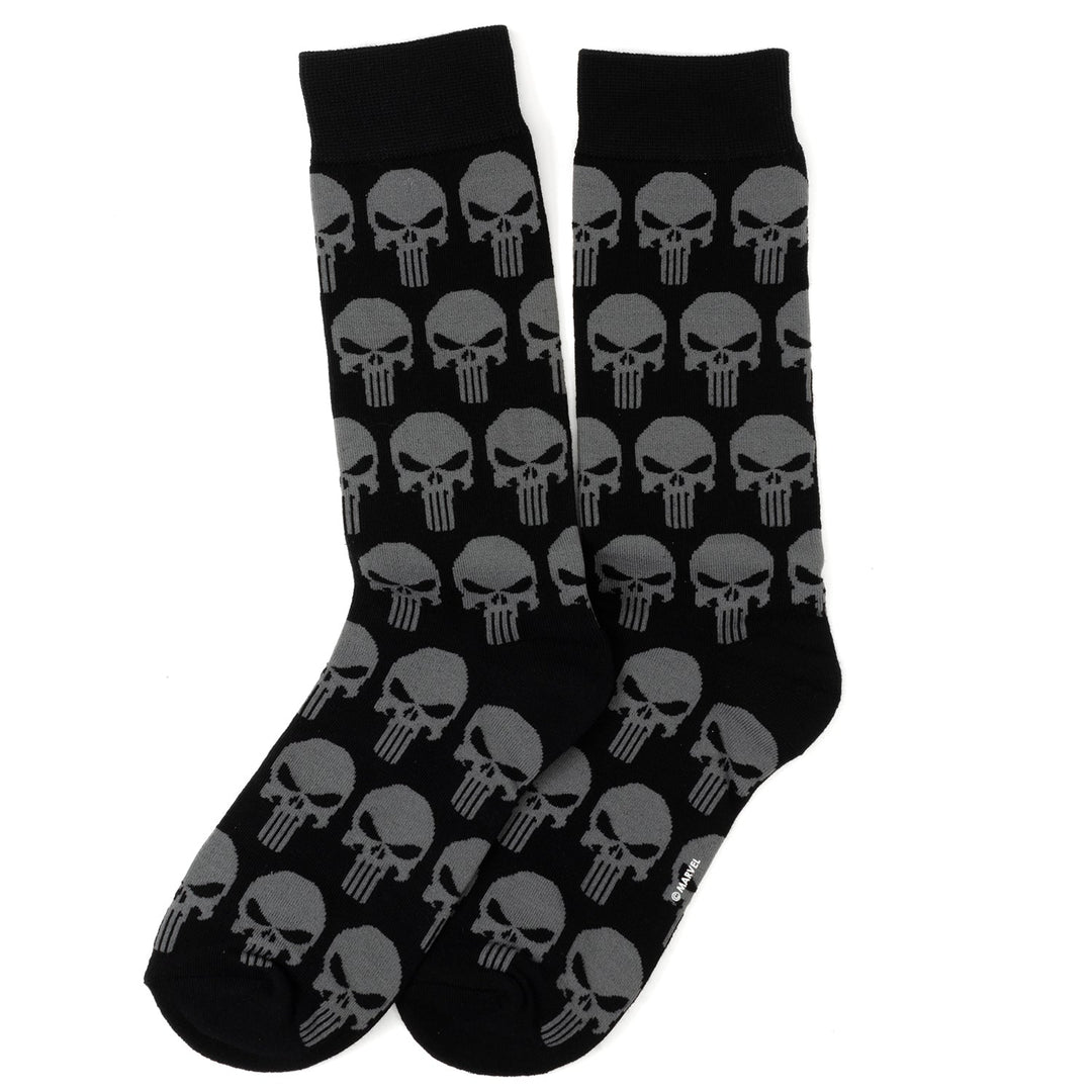 A pair of black crew socks with a repeating gray Punisher skull pattern from the Marvel Punisher Black Socks and Silver Lapel Pin Gift Set.