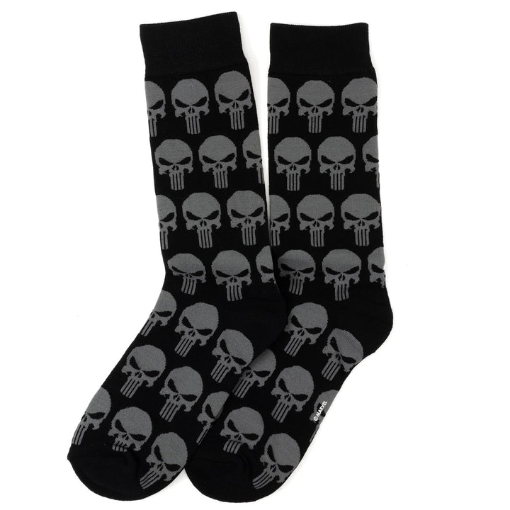 A pair of black crew socks with a repeating gray Punisher skull pattern from the Marvel Punisher Black Socks and Silver Lapel Pin Gift Set.
