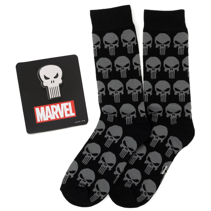 Marvel Punisher Black Socks and Silver Lapel Pin Gift Set featuring black socks with a grey skull pattern and a matching silver skull lapel pin on a black backing card.