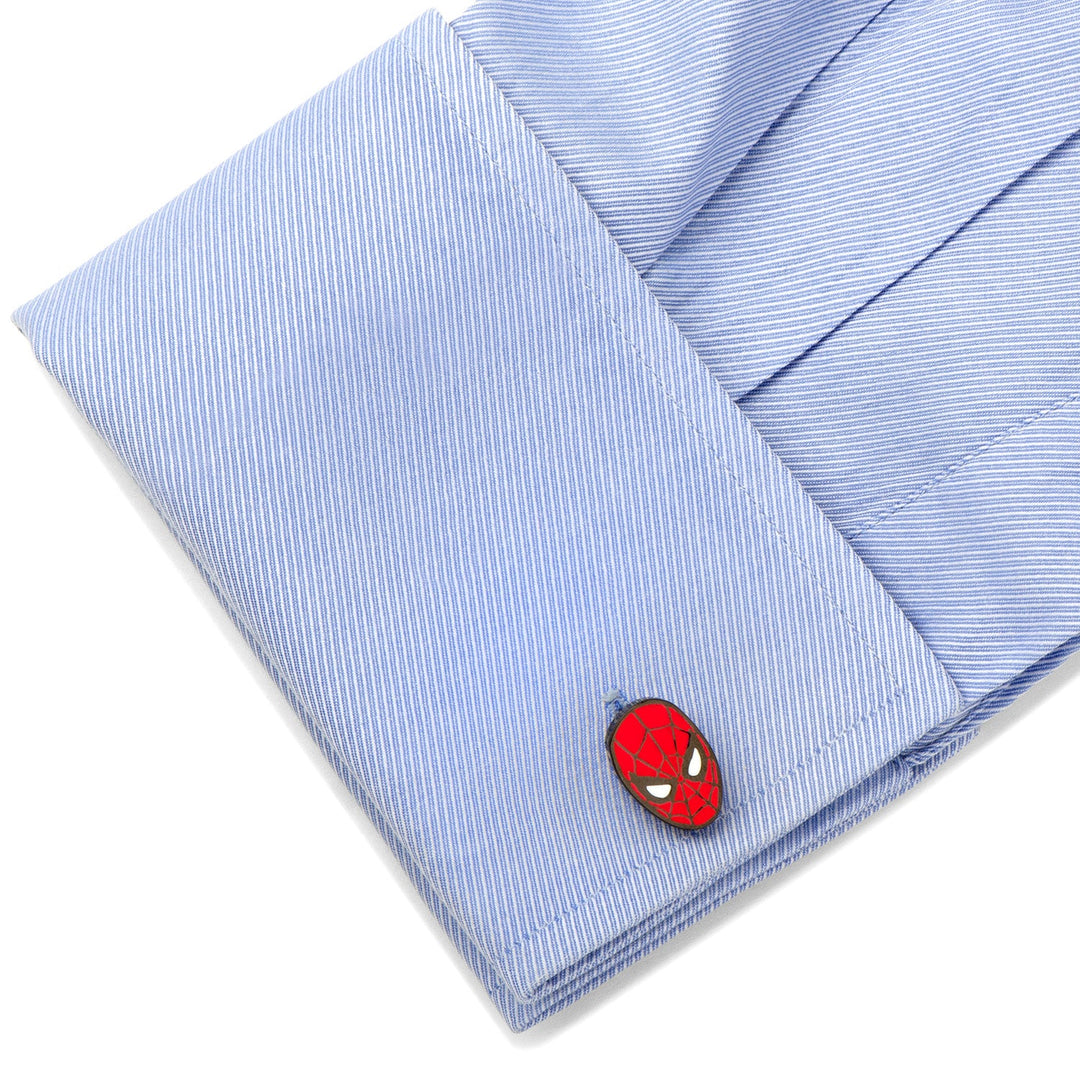 Marvel Spider-Man Cufflinks in the shape of a red and black mask on a blue dress shirt sleeve.