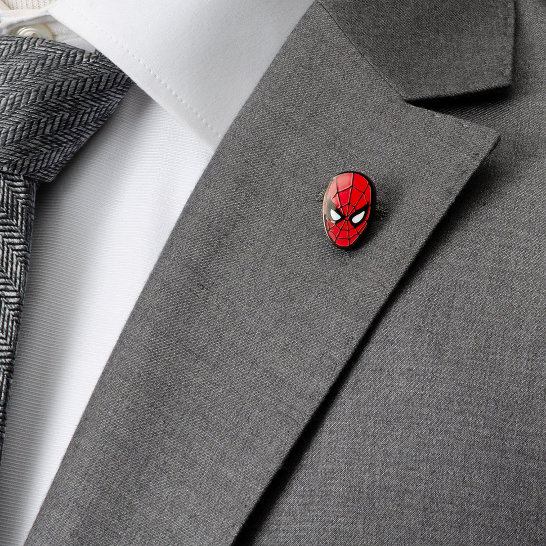 A Marvel Spider-Man Lapel Pin attached to the lapel of a grey suit jacket.