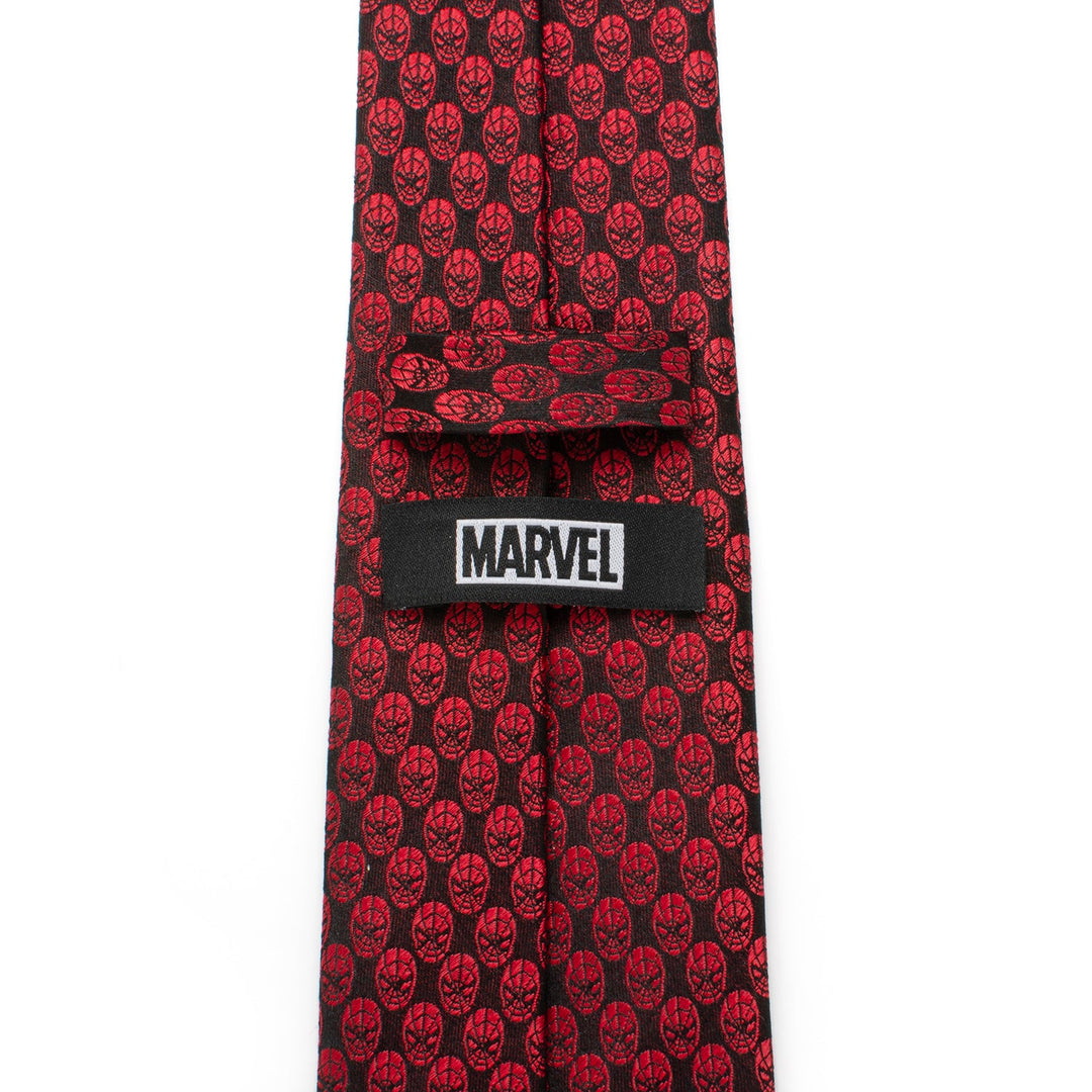 Marvel Spider-Man Mask Red Men’s Tie in crimson featuring a repeating pattern of black Spider-Man masks and a black label with the word “MARVEL” in white text.