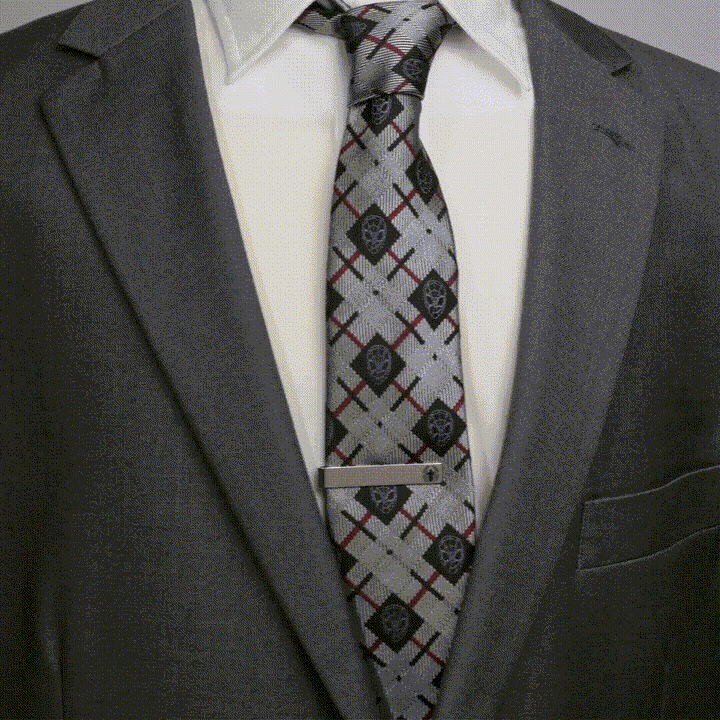Silver Marvel Spider-Man Spider Tie Bar worn on a patterned tie with a grey suit and white dress shirt.