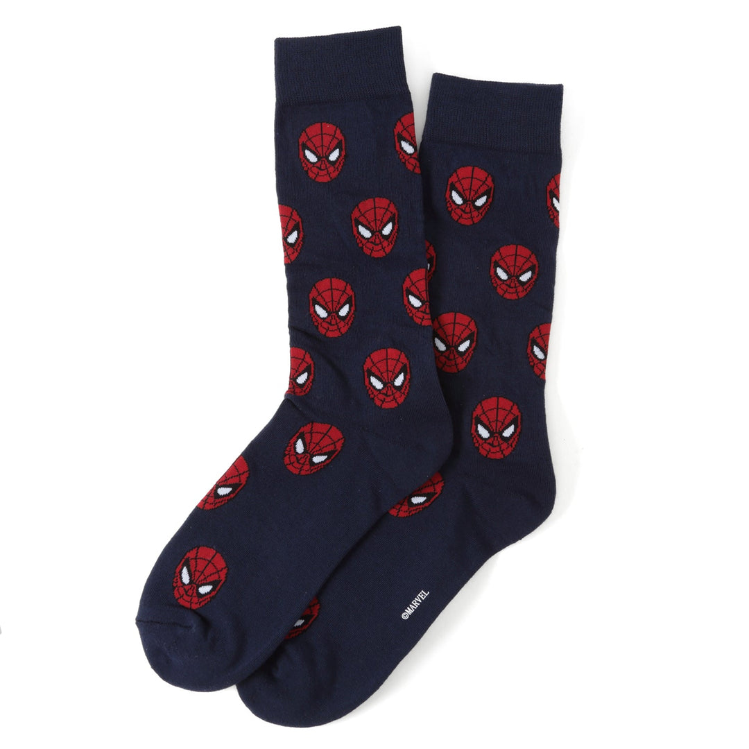 A pair of navy blue Marvel Spider-Man 3 Pack Socks and Lapel Pin Gift Set socks patterned with red masks.