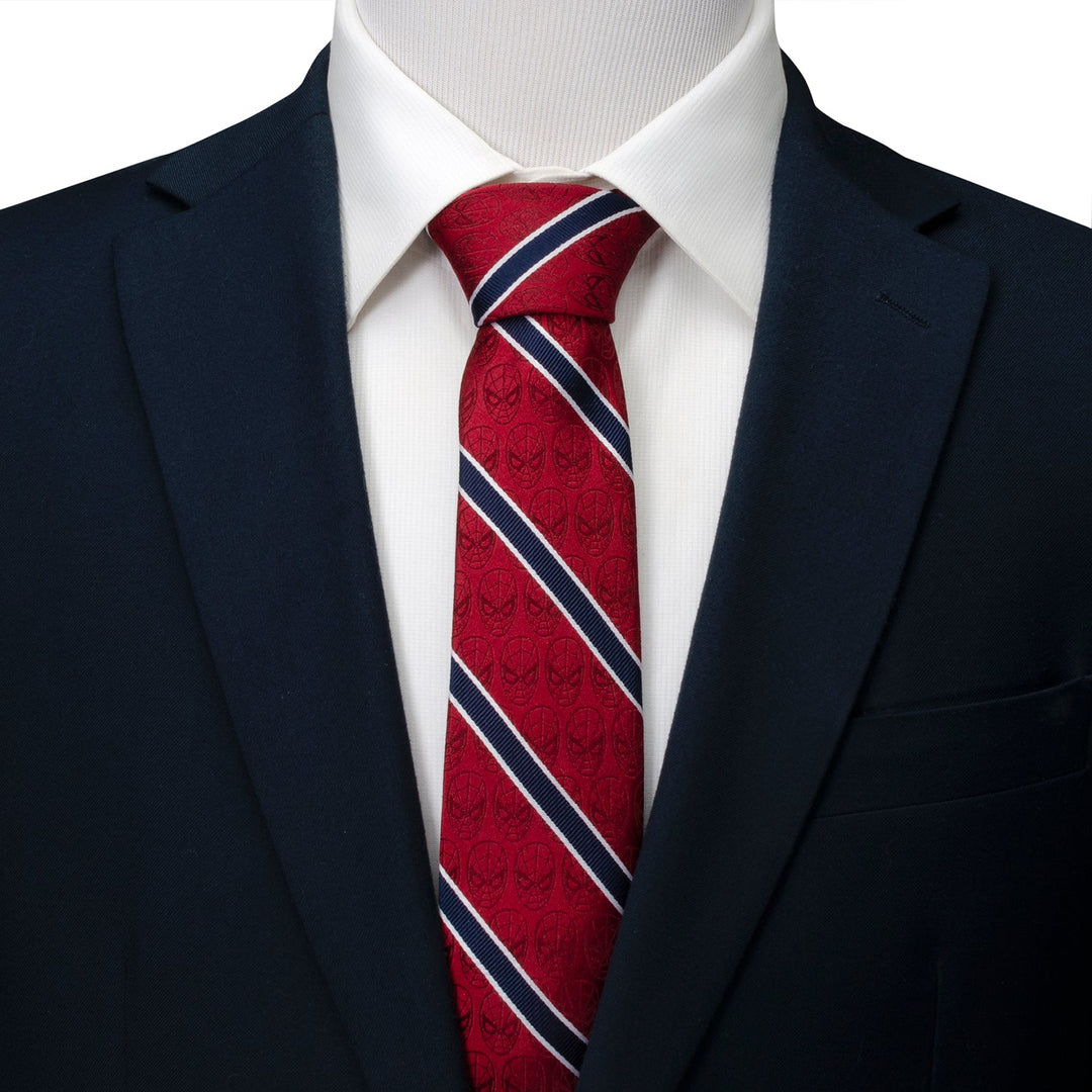 Marvel Spider-Man Red and Navy Stripe Men’s Tie in red silk with navy and white diagonal stripes and a subtle mask pattern, worn with a white shirt and navy blazer.