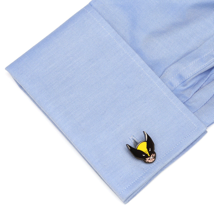 Marvel X-Men Wolverine Cufflinks attached to a blue French cuff shirt sleeve.