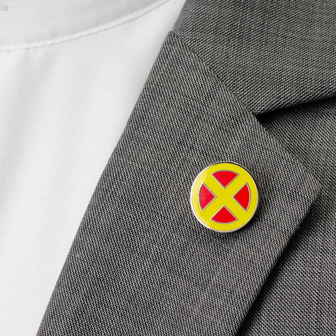 A Marvel X-Men Lapel Pin with a round red and yellow logo attached to a grey blazer.