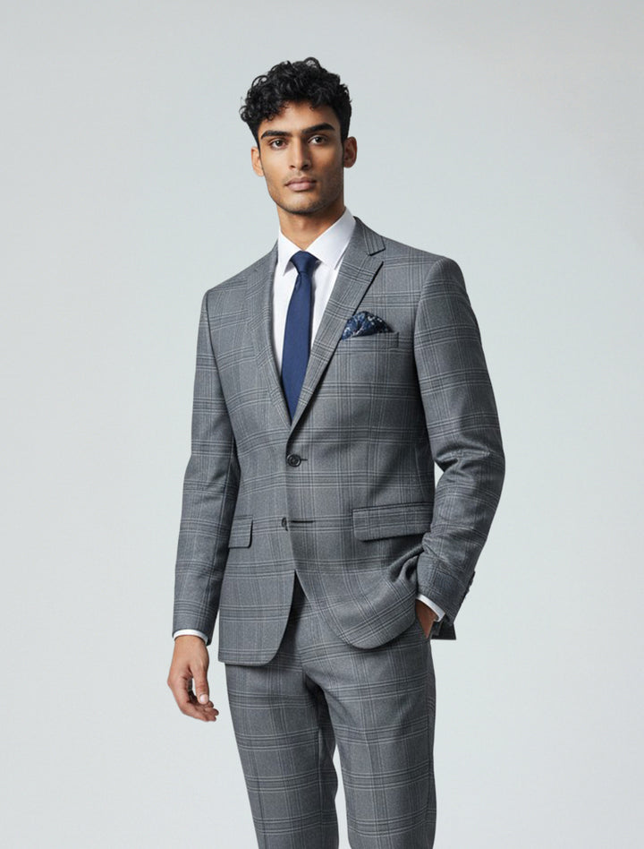 A man stands confidently with one hand in his pocket, dressed in the Alberto Cardina Men&