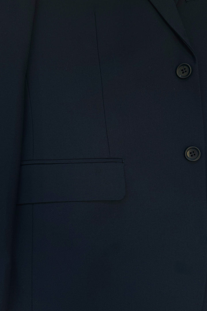 Close-up of the Karako Men Mens Navy Suit, featuring buttons, a lapel, and a side flap pocket—perfect as a men’s wedding suit.
