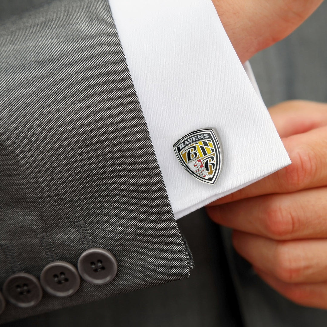 NFL Baltimore Ravens Shield Cufflinks shaped like shields on a white shirt cuff.