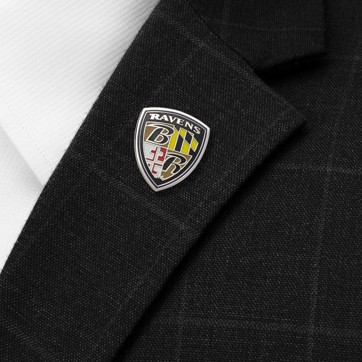 NFL Baltimore Ravens Shield Lapel Pin attached to the lapel of a dark blazer.