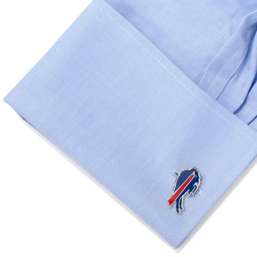 A blue NFL Buffalo Bills Cufflink attached to the cuff of a light blue button-down shirt.