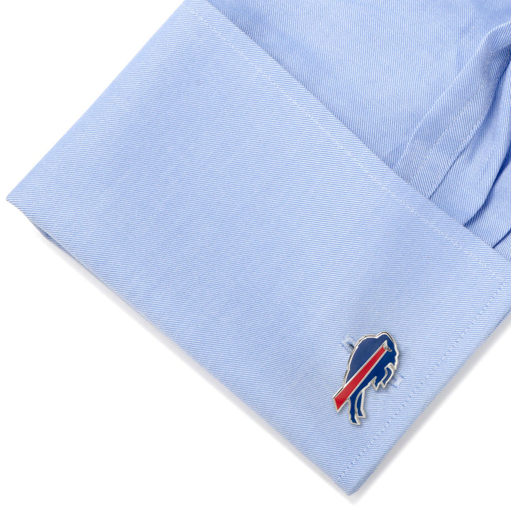 A blue NFL Buffalo Bills Cufflink attached to the cuff of a light blue button-down shirt.