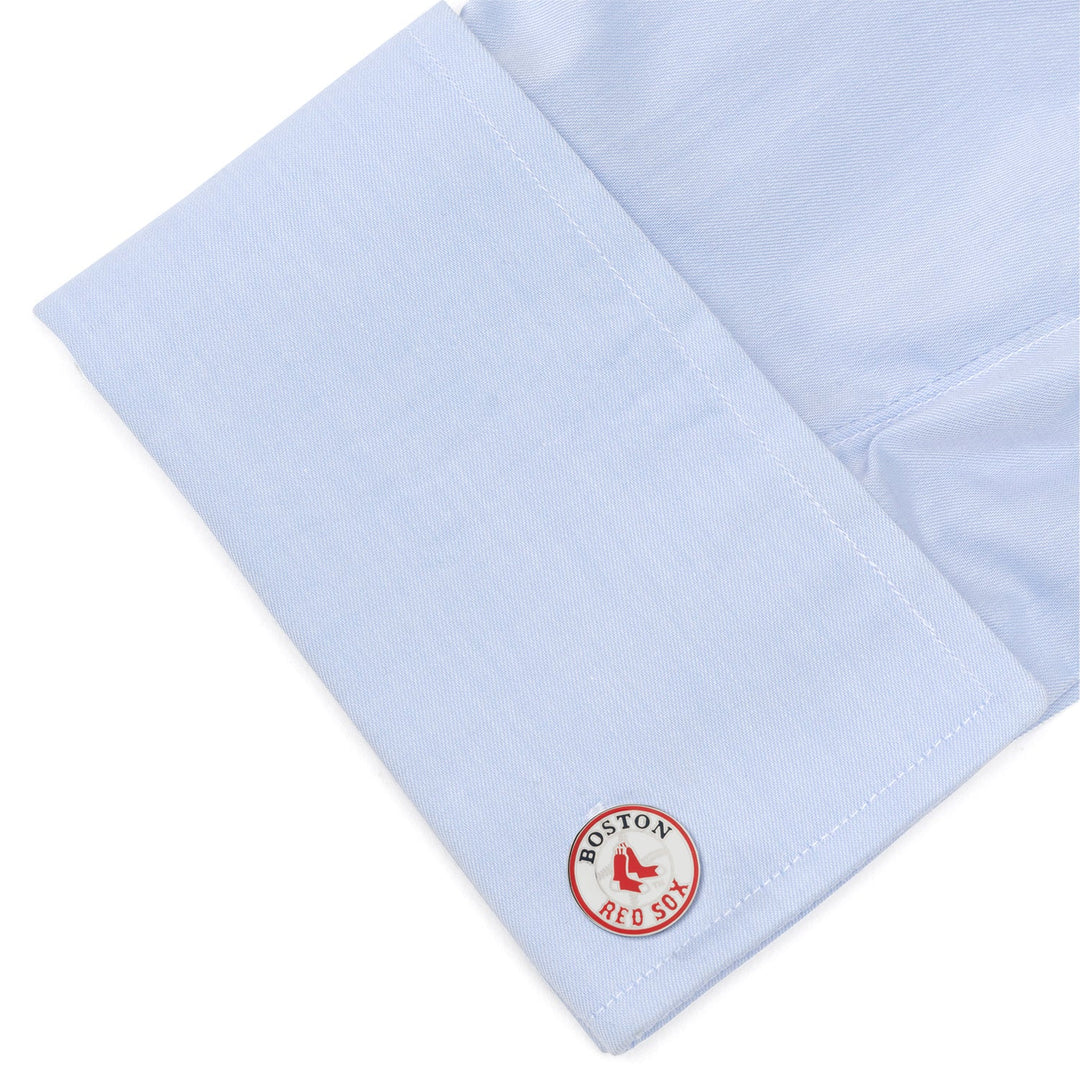 A light blue French cuff sleeve fastened with a round MLB Boston Red Sox Cufflink.
