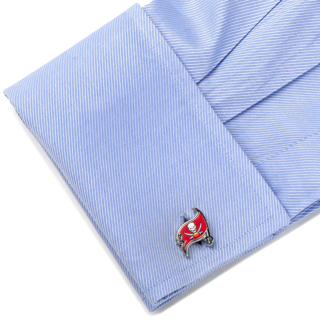 An NFL Tampa Bay Buccaneers Cufflinks logo fastened to the cuff of a light blue dress shirt.