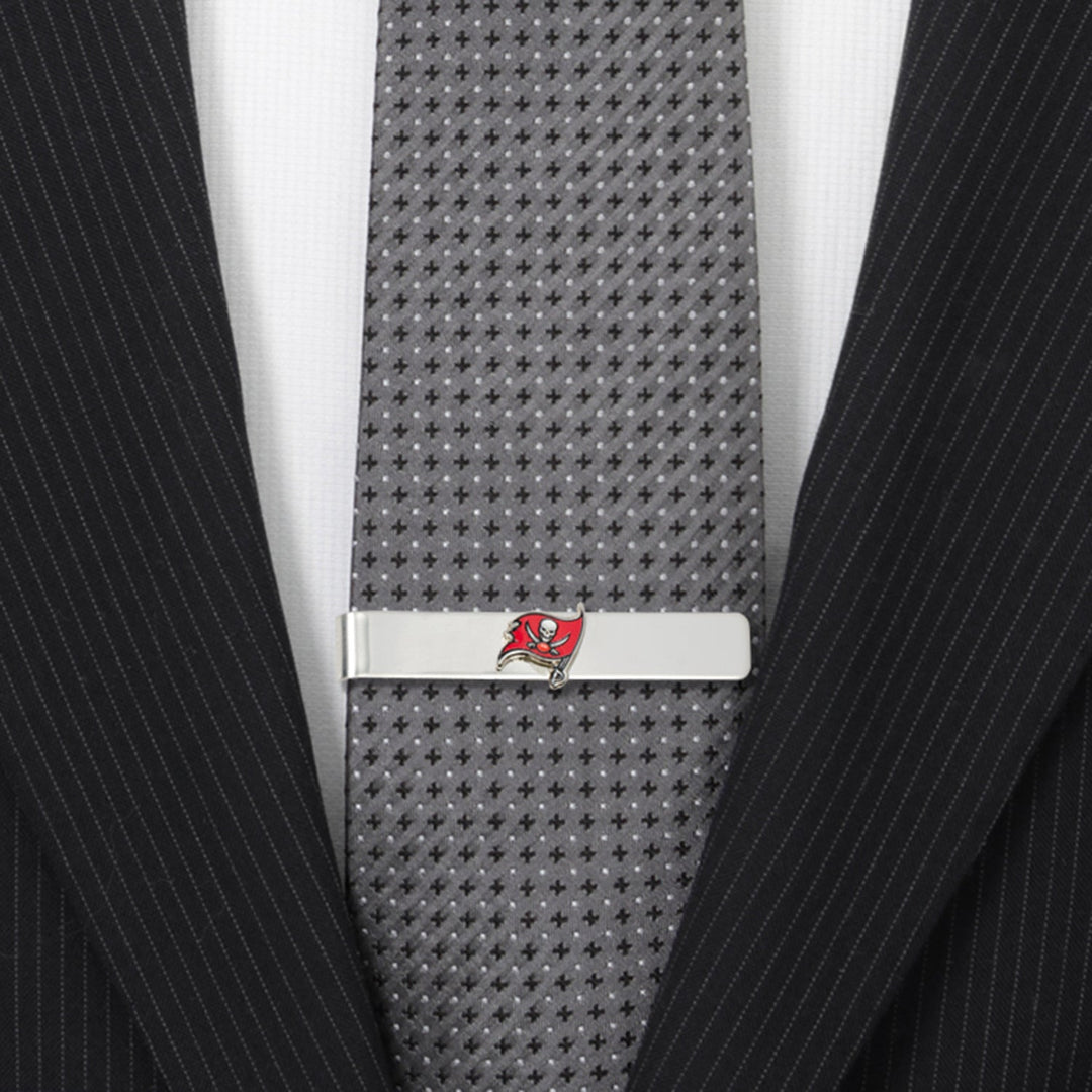 Silver NFL Tampa Bay Buccaneers Tie Bar clipped onto a grey patterned necktie.