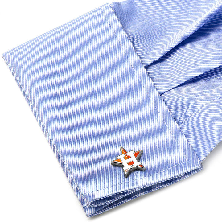 MLB Houston Astros Cufflinks featuring an orange and white H inside a silver star shape, fastened to a light blue dress shirt cuff.