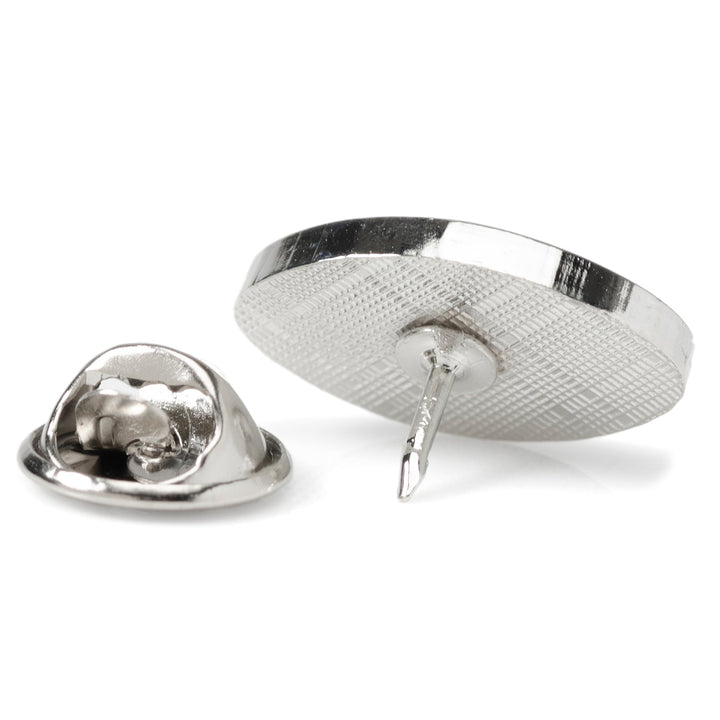 The back of an NFL New York Jets Lapel Pin shown with its detached clutch fastener.