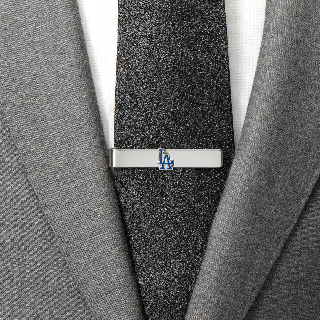 Silver-tone MLB LA Dodgers Tie Bar worn on a black tie and gray suit jacket.