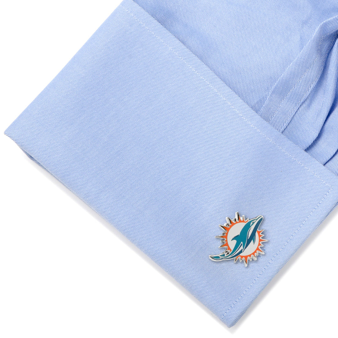 NFL Miami Dolphins Cufflinks attached to a light blue dress shirt cuff.