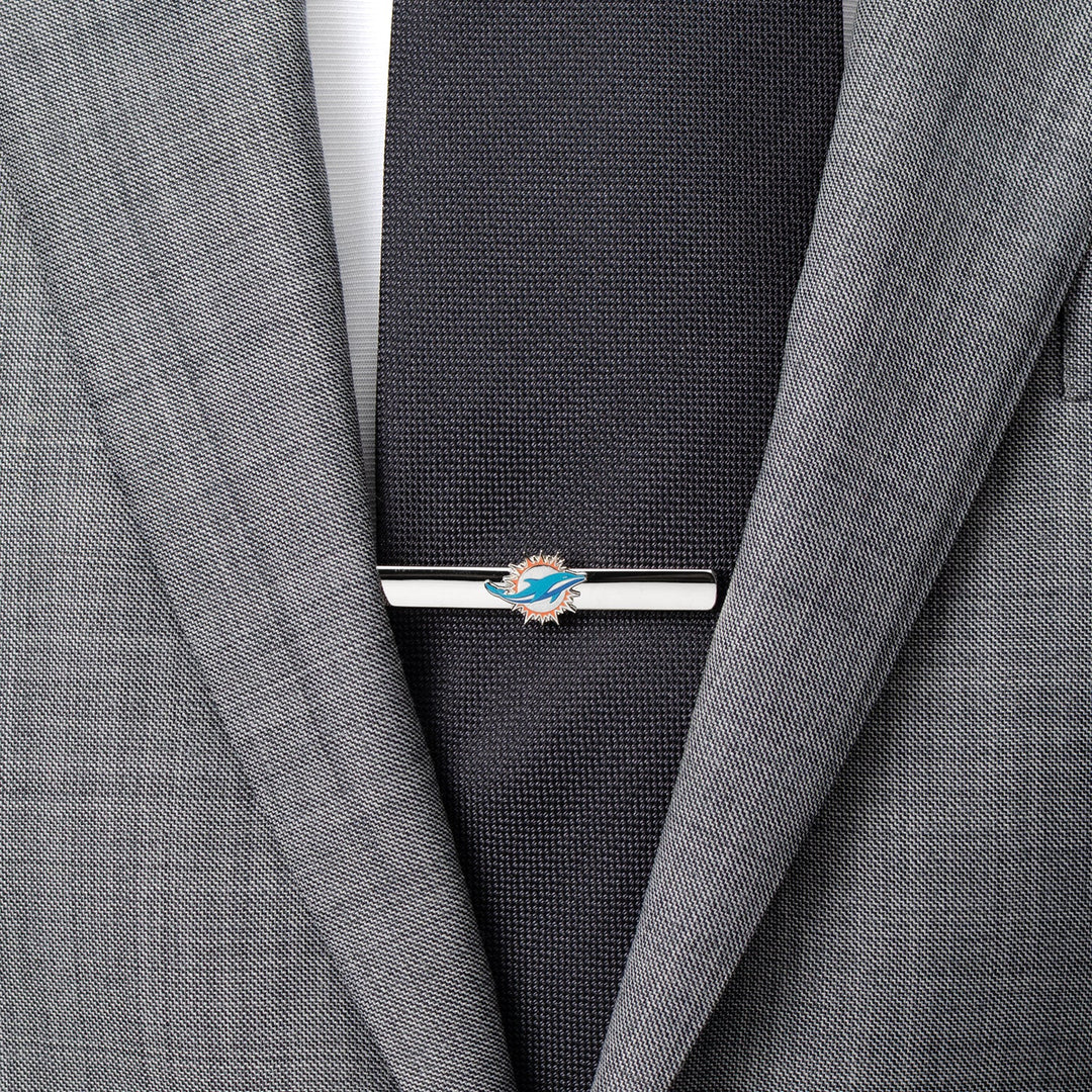 Silver-tone NFL Miami Dolphins Tie Clip worn on a dark tie and grey suit jacket.