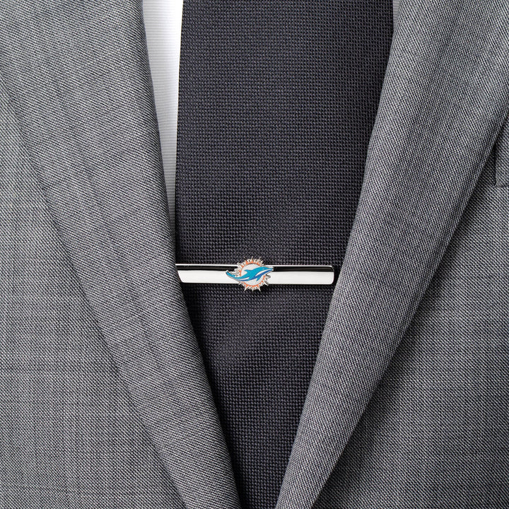 Silver-tone NFL Miami Dolphins Tie Clip worn on a dark tie and grey suit jacket.