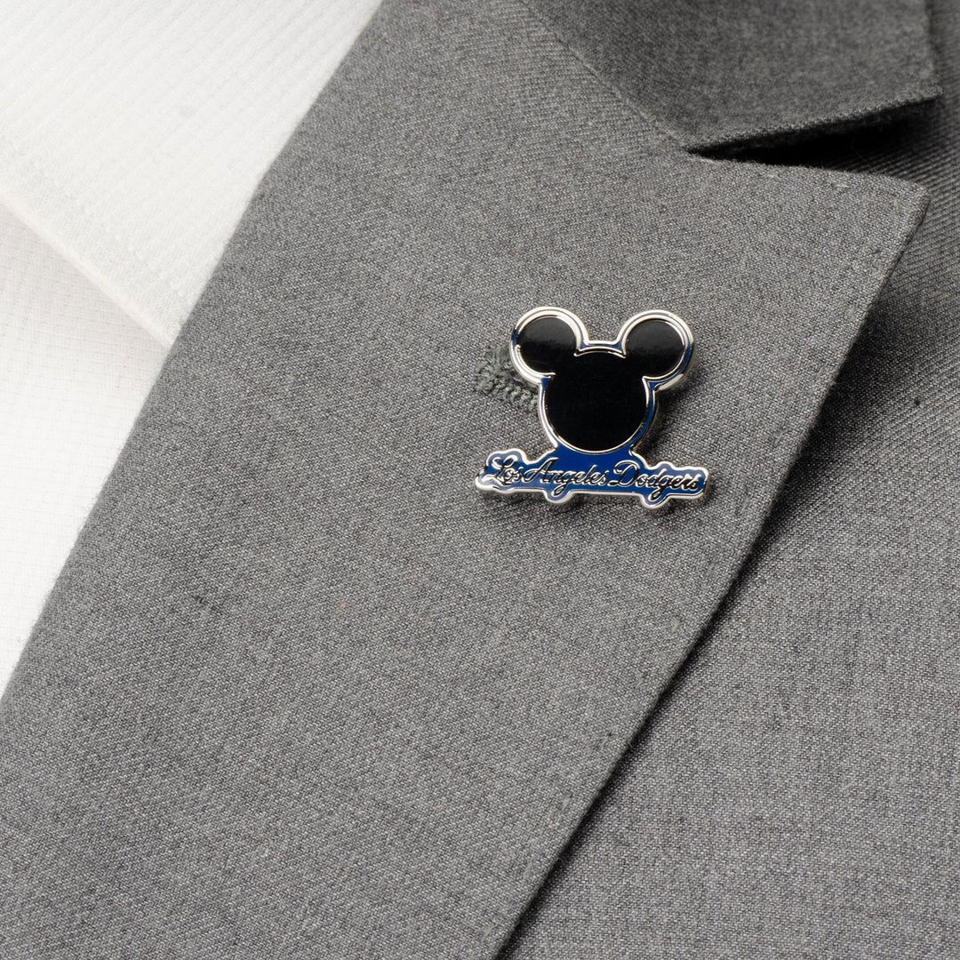A Mickey &amp; LA Dodgers Lapel Pin in the shape of Mickey Mouse attached to a grey suit jacket.