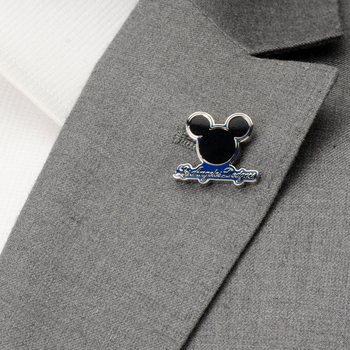 A Mickey &amp; LA Dodgers Lapel Pin in the shape of Mickey Mouse attached to a grey suit jacket.