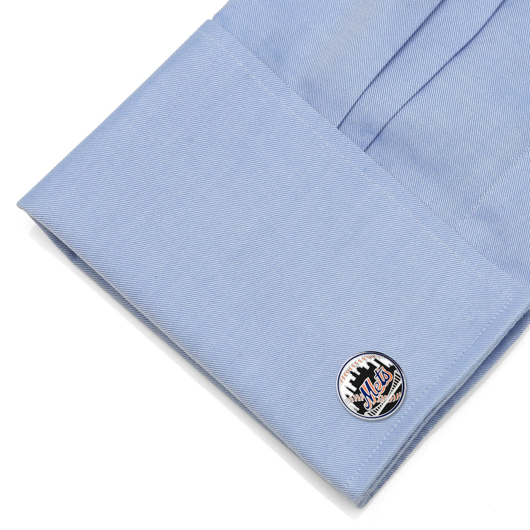 Round MLB New York Mets Baseball Cufflinks featuring a baseball design, fastened to a light blue dress shirt cuff.