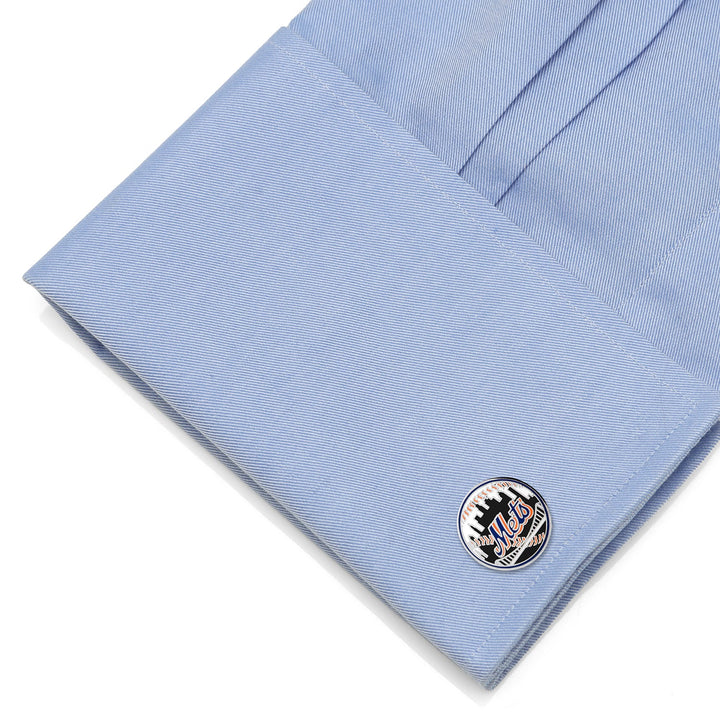 Round MLB New York Mets Baseball Cufflinks featuring a baseball design, fastened to a light blue dress shirt cuff.