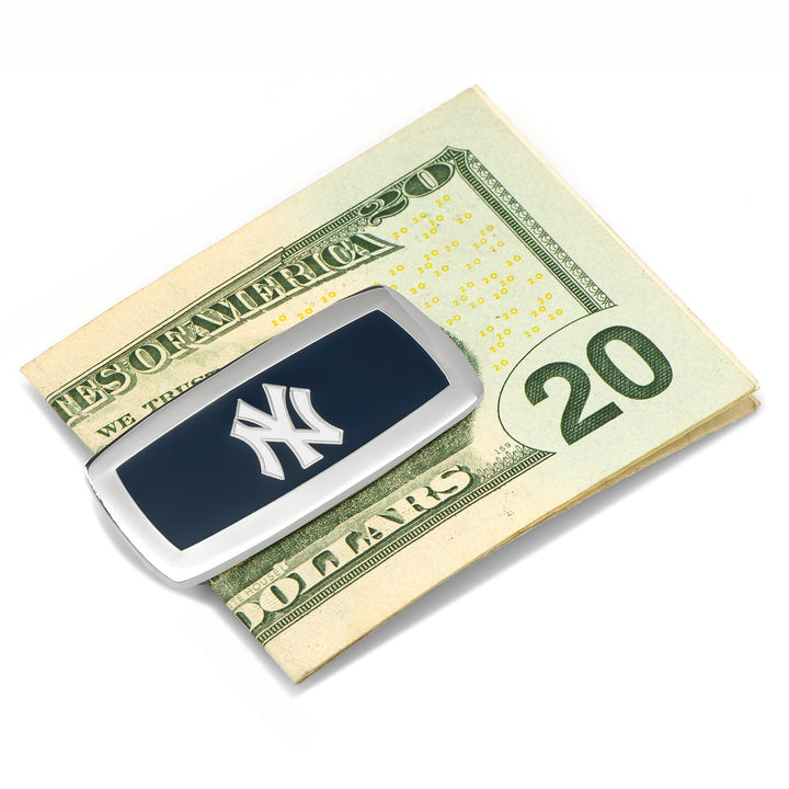 An MLB New York Yankees Cushion Money Clip featuring a silver-toned finish and a dark blue rectangle with the team logo, holding a folded twenty-dollar bill.
