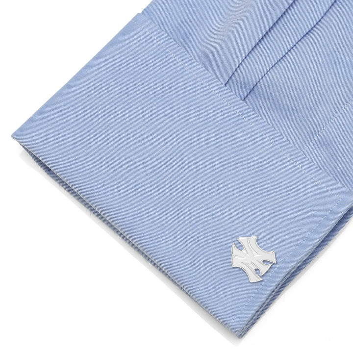 MLB New York Yankees Silver Logo Cufflinks attached to a light blue dress shirt cuff.