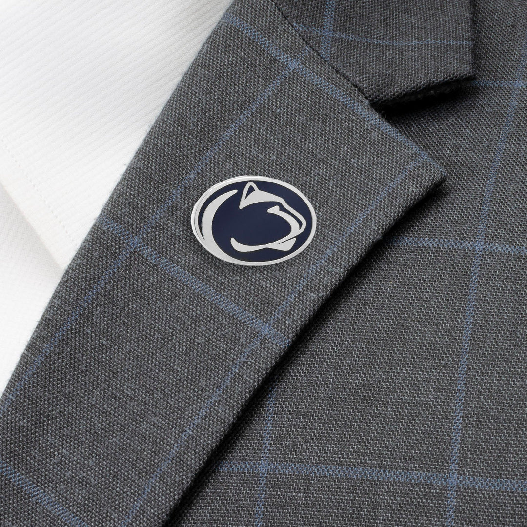 Oval NCAA Penn State University Nittany Lions Lapel Pin featuring a blue and white logo attached to a grey plaid blazer lapel.