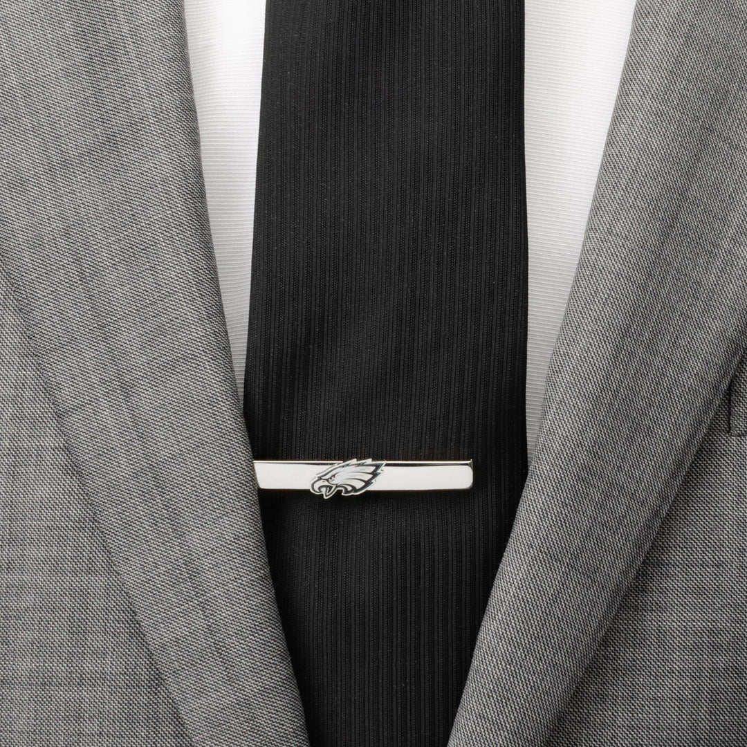 Silver-tone NFL Philadelphia Eagles Tie Clip worn on a black tie and grey suit jacket.