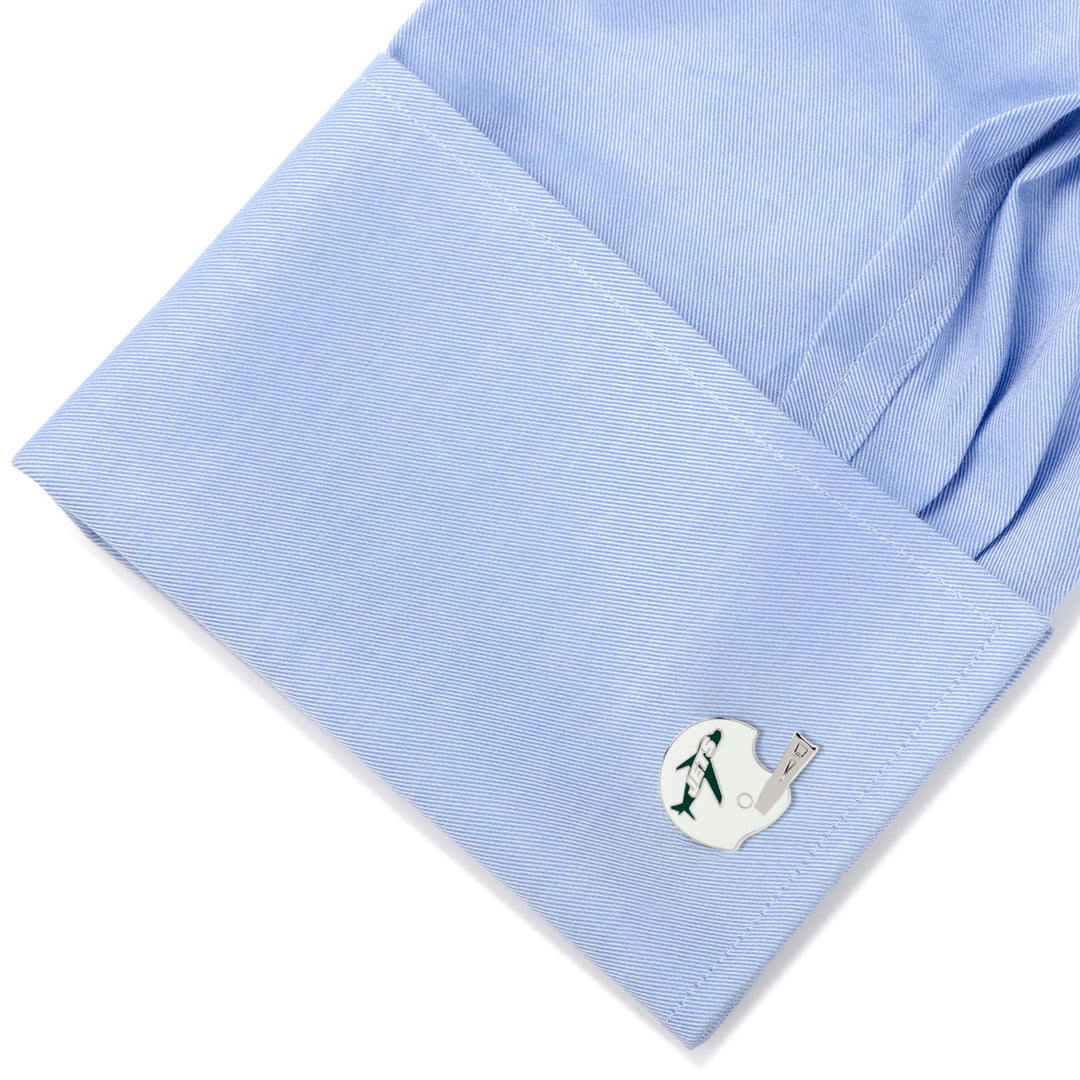 A shirt cuff wearing silver-toned NFL New York Jets Retro Helmet Cufflinks featuring a green airplane logo.