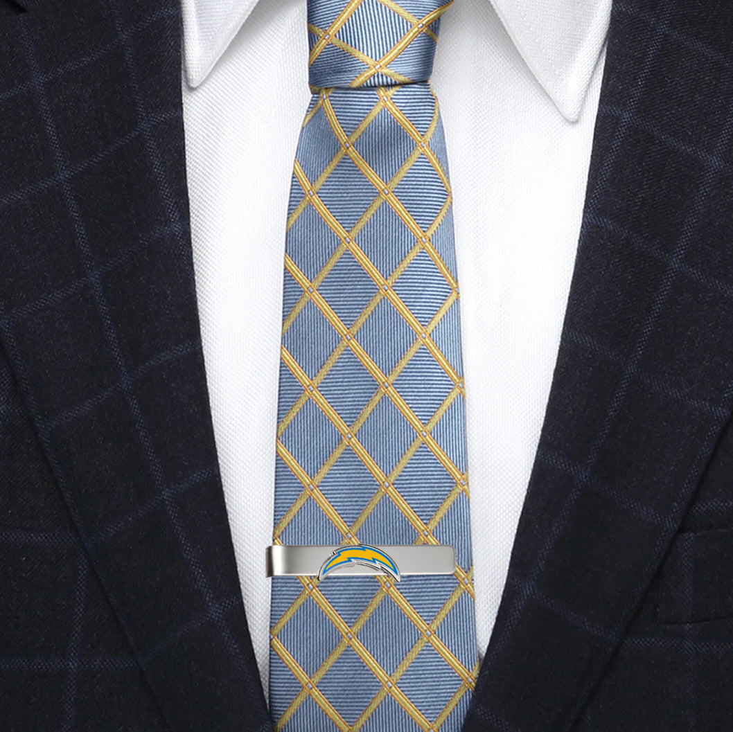 Silver-tone NFL Los Angeles Chargers Tie Bar clipped onto a blue and yellow plaid necktie.