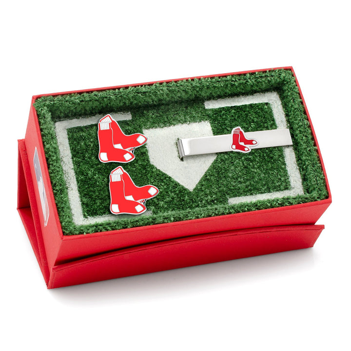 MLB Boston Red Sox Cufflinks and Tie Bar Gift Set featuring cufflinks and a tie bar with a red sock logo, presented in a red home plate-shaped gift box.