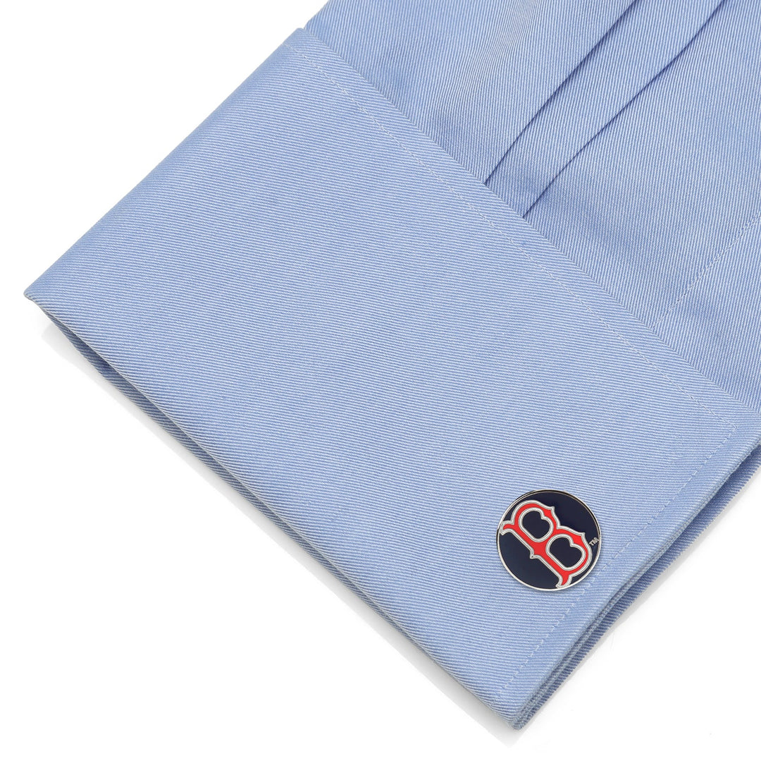 A light blue French cuff fastened with round MLB Boston Red Sox Classic Cufflinks featuring the team’s red “B” logo on a navy blue background.