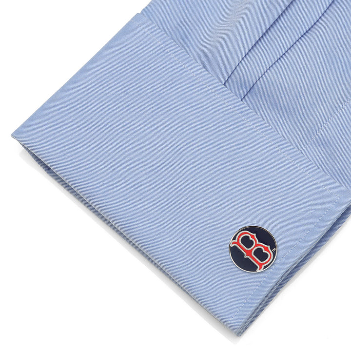 A light blue French cuff fastened with round MLB Boston Red Sox Classic Cufflinks featuring the team’s red “B” logo on a navy blue background.