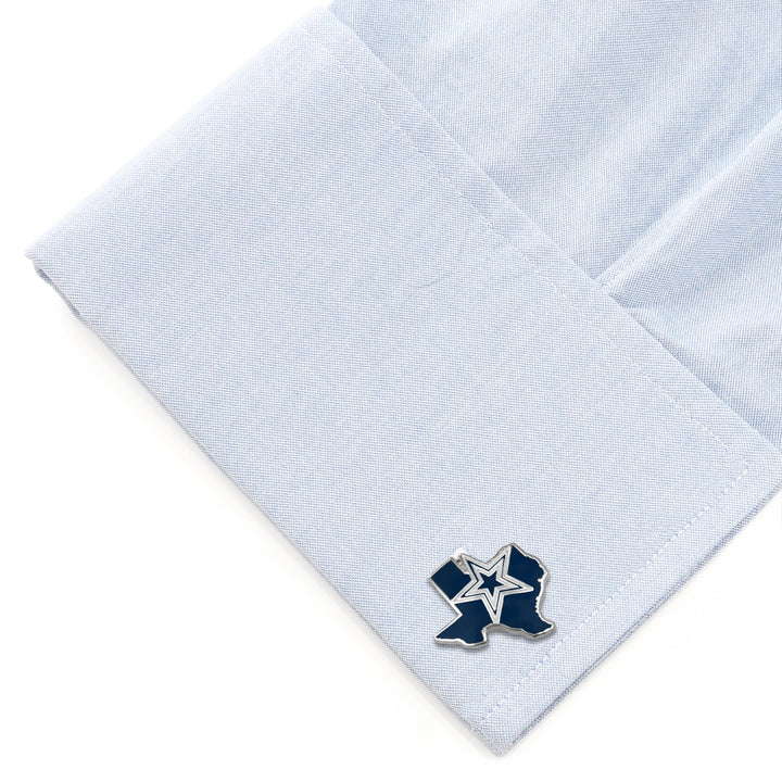NFL Dallas Cowboys State Shaped Cufflinks shaped like the state of Texas with a blue star emblem, attached to a light blue dress shirt cuff.