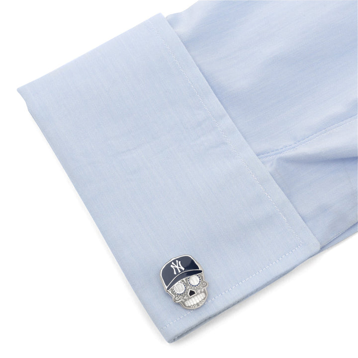 MLB New York Yankees Sugar Skull Cufflinks shaped like a sugar skull attached to a light blue dress shirt cuff.