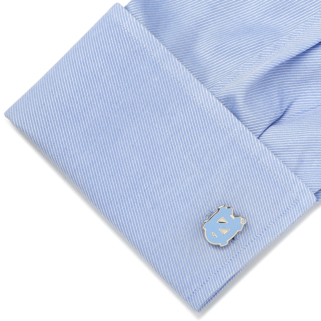 Light blue button-down shirt cuff featuring a silver and light blue NCAA University of North Carolina Tar Heels Cufflinks.