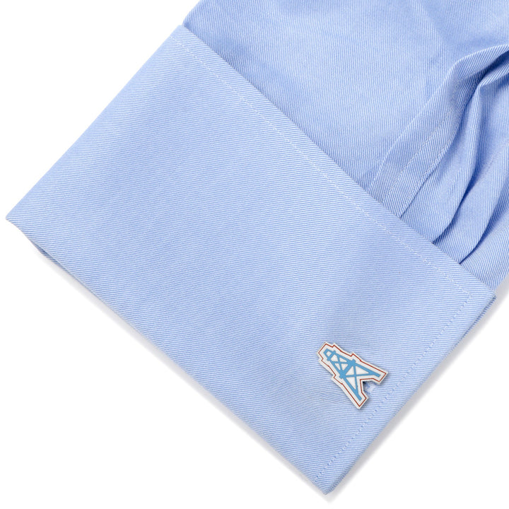 A blue shirt cuff featuring NFL Houston Oilers Vintage Cufflinks.
