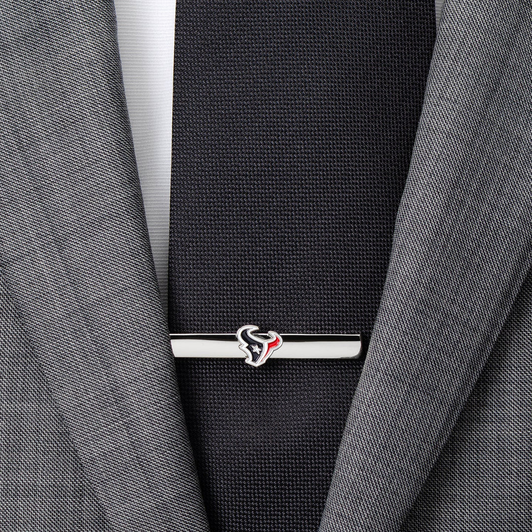 Silver-toned NFL Houston Texans Tie Clip fastened across a black necktie and grey suit jacket.
