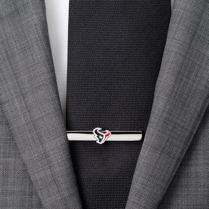 Silver-toned NFL Houston Texans Tie Clip fastened across a black necktie and grey suit jacket.