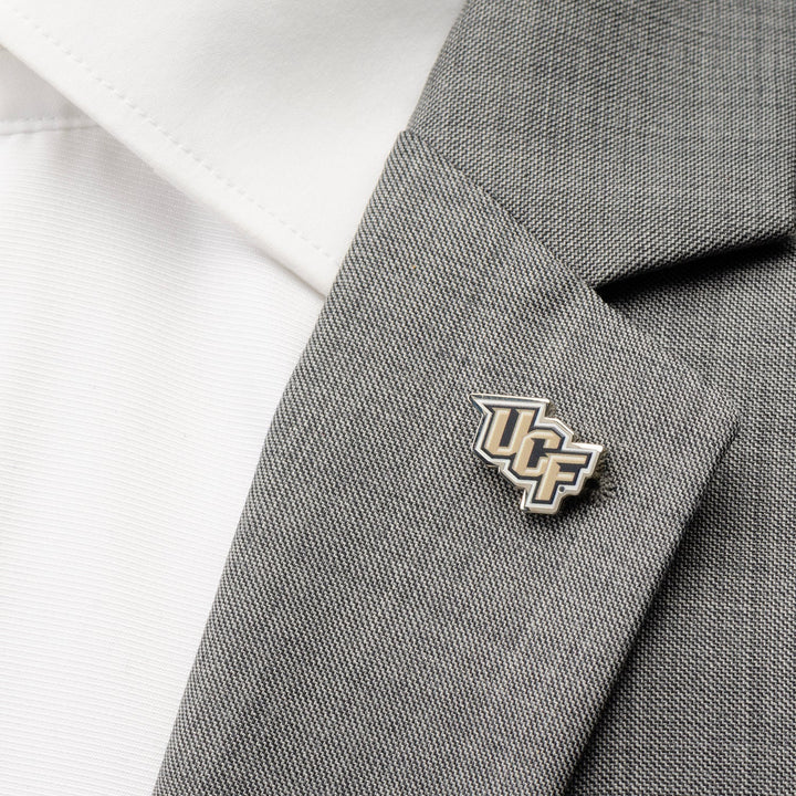 A NCAA University of Central Florida Knights Lapel Pin attached to the lapel of a grey suit jacket.