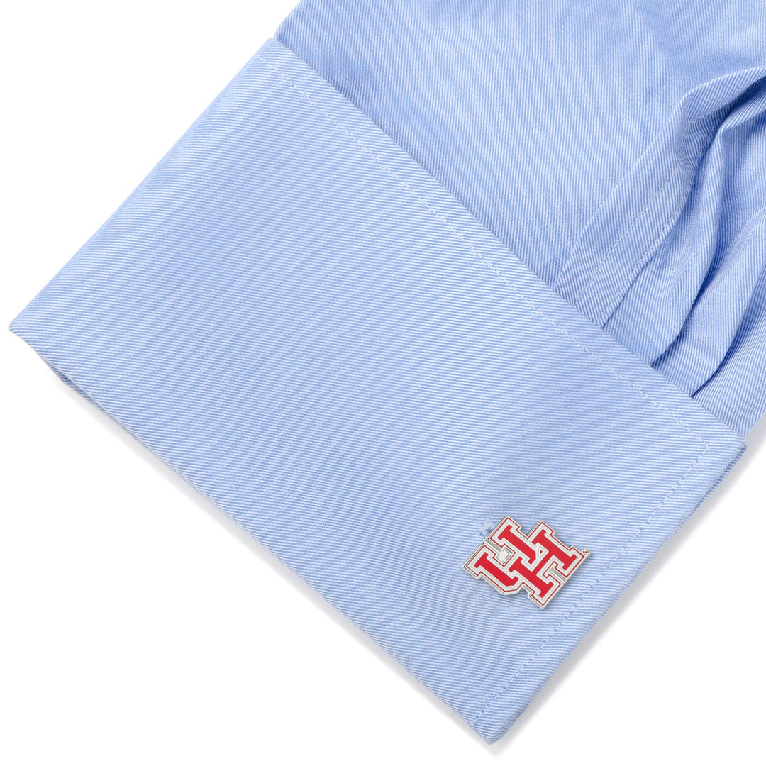 Light blue French cuff fastened with a silver and red NCAA University of Houston Cufflinks.