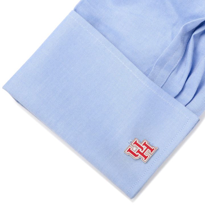 Light blue French cuff fastened with a silver and red NCAA University of Houston Cufflinks.